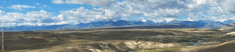 Majestic snow mountain ranges under cloudy sky. Awesome scenery high snow mountains valley in low clouds. Atmospheric mountain landscaped, panoramic view. Majestic snow mountain ranges under cloudy sky. Awesome scenery high snow mountains valley in low clouds. Atmospheric mountain landscaped, panoramic view.