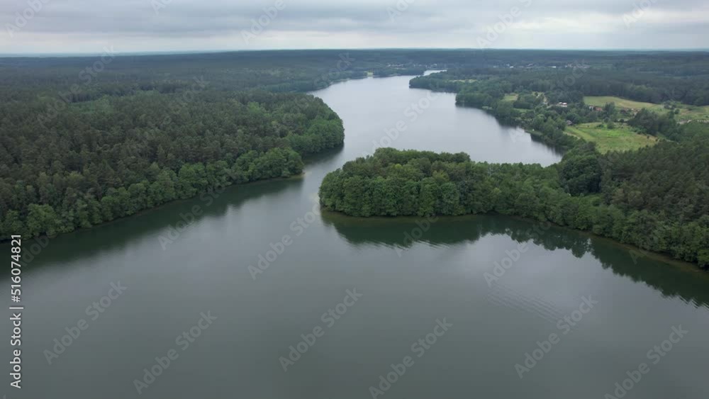 Spectacular Beautiful Lake Aerial View in Poland Village. Countryside with Woods and Lake in Europe. Dramatic Aerial View of Big Lake and Green Forest. Epic Amazing Nature Landscape Nature Reserve. Spectacular Beautiful Lake Aerial View in Poland Village. Countryside with Woods and Lake in Europe. Dramatic Aerial View of Big Lake and Green Forest. Epic Amazing Nature Landscape Nature Reserve.