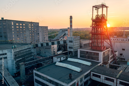 Underground black coal mine from drone during sunrise. View on the plant with mining tower. © davidjancik