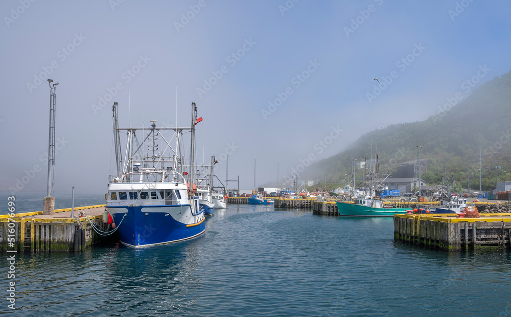 Fishing boats in fog at the St. John’s Harbour