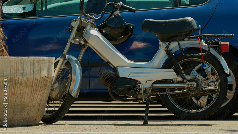 Old motobike in the city Old motobike in the city