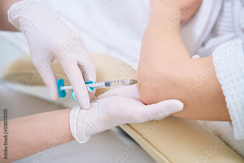 Canvas Print Close up of injection in the elbow for lady