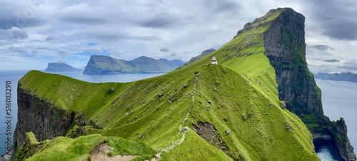 Panoramic view of the cliffs around kallur lighthouse, kalsoy island, Faroe  photo