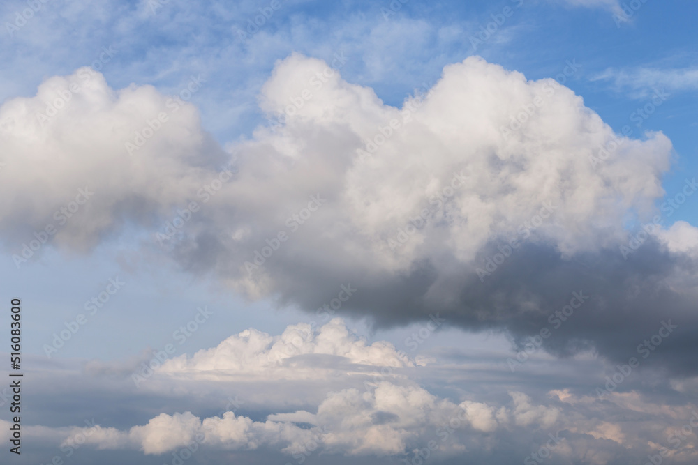 Epic Blue sky with big white fluffy cumulus storm clouds. Abstract background texture Epic Blue sky with big white fluffy cumulus storm clouds. Abstract background texture
