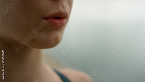 Unknown girl inhaling exhaling practicing yoga meditation on nature close up. photo