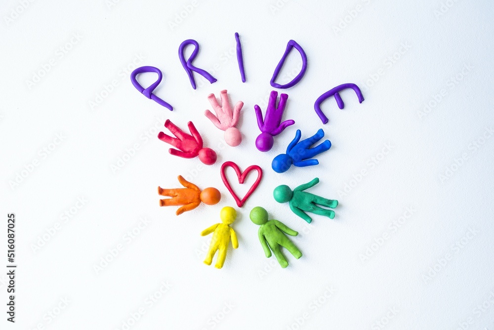 Banner, on a white background in a circle lie multi-colored men in the middle of a red heart a sign of love, the inscription pride. Gay pride LGBT community, equal rights movement and gender equality Banner, on a white background in a circle lie multi-colored men in the middle of a red heart a sign of love, the inscription pride. Gay pride LGBT community, equal rights movement and gender equality