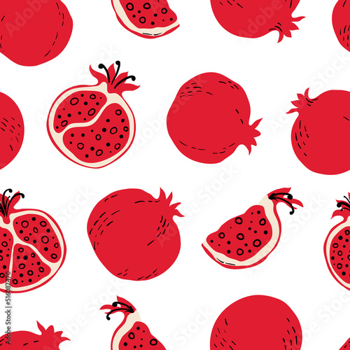 Seamless pattern with red pomegranates and pomegranate slices. Hand drawn pomegranates pattern on white background. for fabric, drawing labels, print, wallpaper of children's room, fruit background