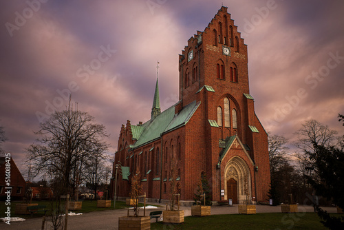 Hässleholms kyrka. The church in Hassleholm in the evening with dramatic clouds in the Sky.