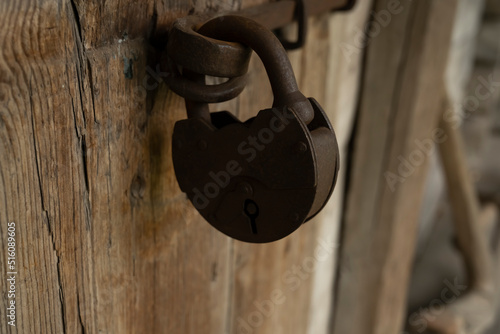 The lock on the door in blur. Old castle. The door is locked