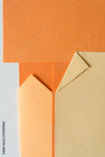 various shades of orange paper (some with folds)