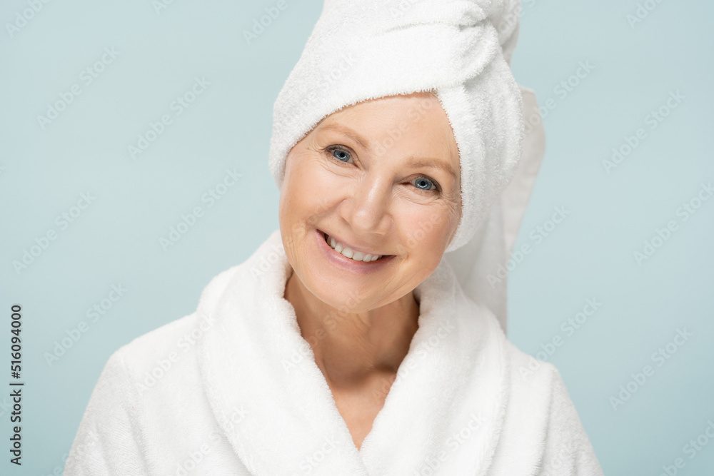 Beauty portrait of mature woman in bathrobe after spa, older beauty face with fresh skin Beauty portrait of mature woman in bathrobe after spa, older beauty face with fresh skin