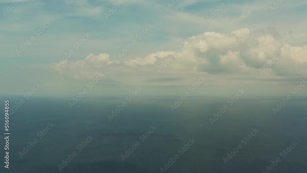 Seascape in cloudy weather, aerial view. Water cloud horizon background. Blue sea water with small waves against sky. Seascape in cloudy weather, aerial view. Water cloud horizon background. Blue sea water with small waves against sky.