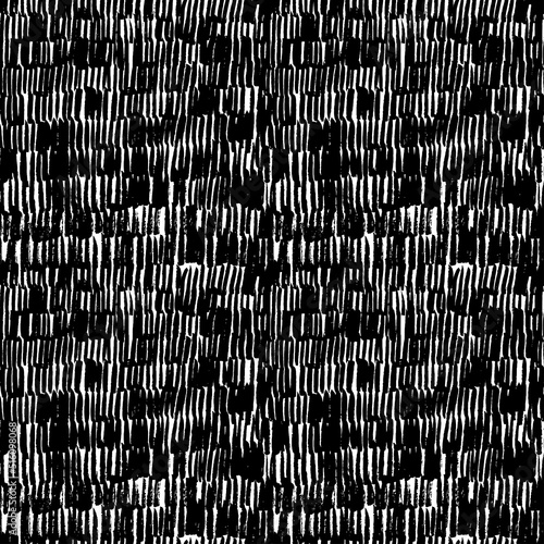 Black irregular vertical lines vector seamless pattern. Rain motif abstract background. Dense texture of dashes. Graphic dashed strokes ornament. Scribbles and small vertical smears, thin lines.