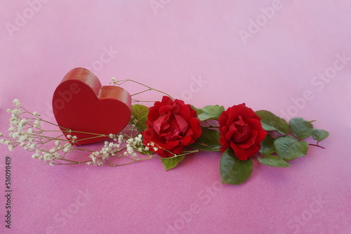 Red Heart Box, Red Roses with Green Leaves, Babysbreath on Pink Background photo