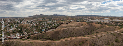 Aerial view of US Mexico Border fence in Nogales, Arizona.  photo
