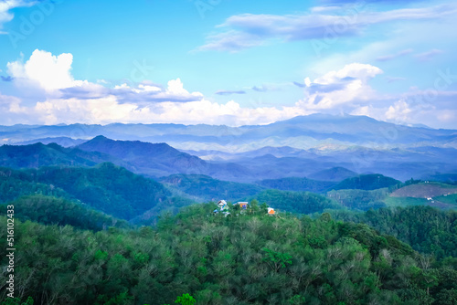 Landscape of misty mountains of Mt.Gunung Silipat Betong,Yala,Thailand. View of coniferous forest, layers of mountain and haze in the hills at distance. Tourism and traveling concept.