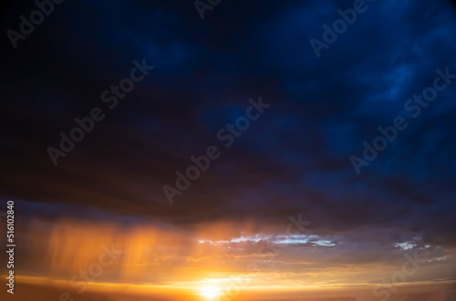 Stormy sky with dramatic clouds from an approaching thunderstorm at sunset © Igor Bastrakov