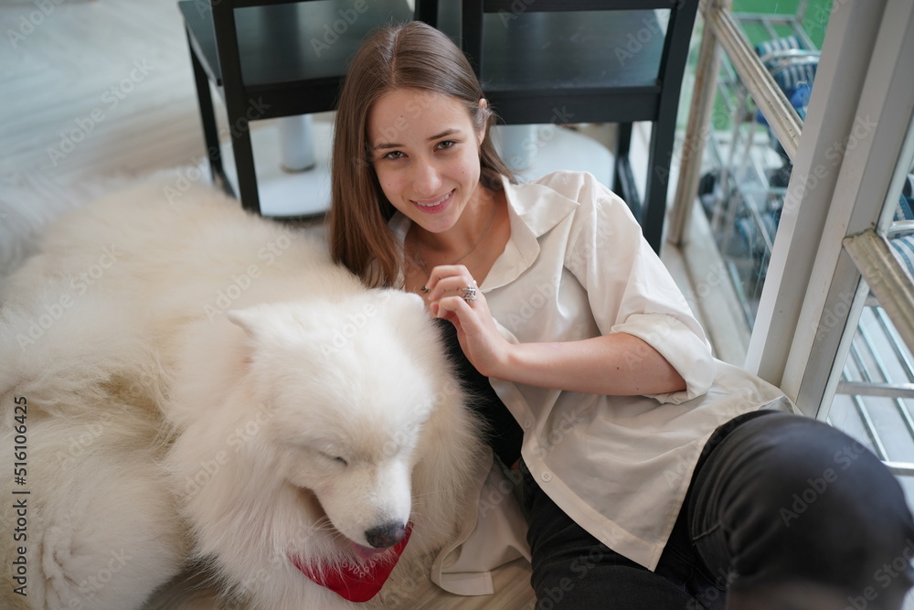 beautiful woman hugging her adorable golden retriever dog at home. love for animals concept. lifestyle indoors beautiful woman hugging her adorable golden retriever dog at home. love for animals concept. lifestyle indoors