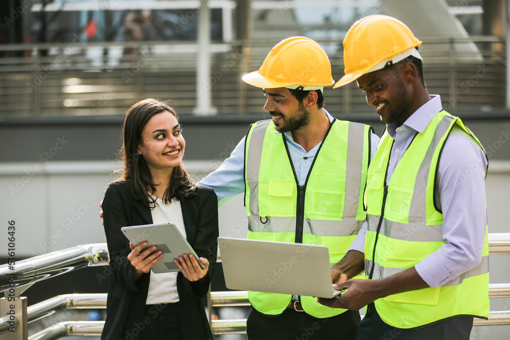 Architects and worker at the construction site.