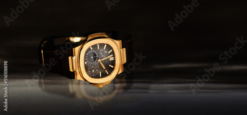 Luxury watches placed on a glittering glass floor  © Diamon jewelry