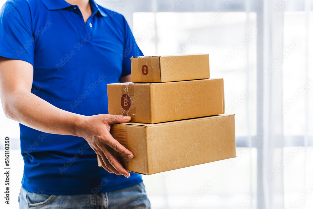 Delivery man service courier with parcels in hands, Asian people. Delivery man service courier with parcels in hands, Asian people.