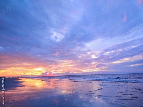 Multicolored Beach Ocean Sunrise Cloudscape and Reflecting Waters