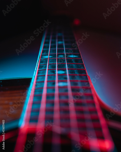 Detailed plan of the strings of an acoustic guitar on a purple background.