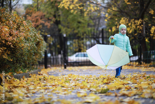 Children walk in the autumn park