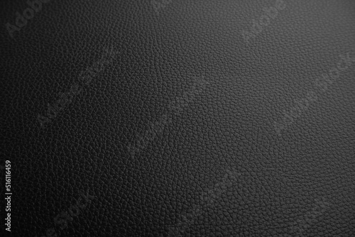Black leather textured background with a lowlight