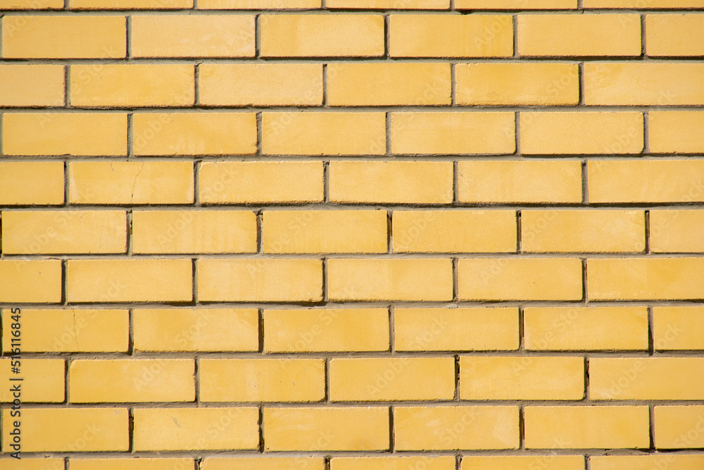 horizontal part of bright yellow painted brick wall closeup texture horizontal part of bright yellow painted brick wall closeup texture