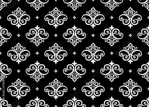 Wallpaper in the style of Baroque. Seamless vector background. White and black floral ornament. Graphic pattern for fabric, wallpaper, packaging. Ornate Damask flower ornament