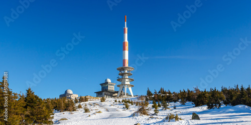 Brocken mountain peak in Harz with snow in winter panorama in Germany photo