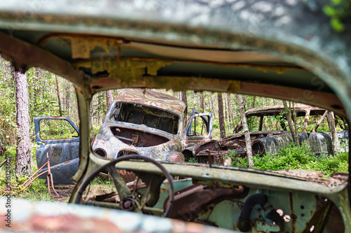 Old car in the junkyard in Kyrkö mosse forest