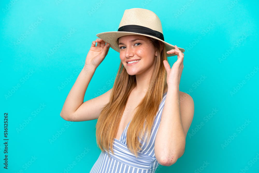 Young woman isolated on blue background happy in swimsuit in summer holidays Young woman isolated on blue background happy in swimsuit in summer holidays