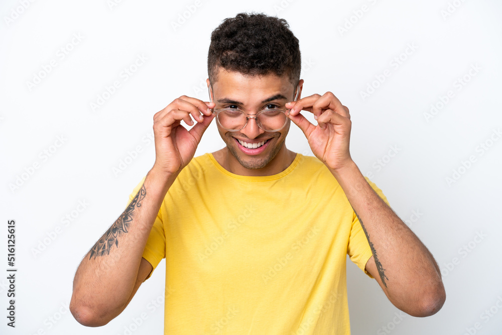 Young Brazilian man isolated on white background With glasses with happy expression Young Brazilian man isolated on white background With glasses with happy expression