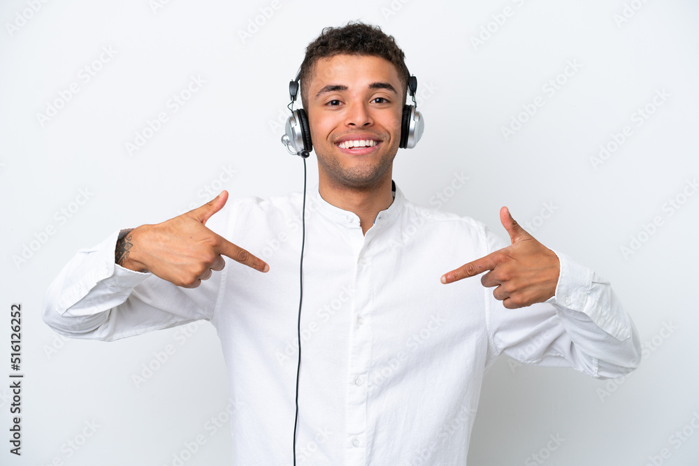 Telemarketer Brazilian man working with a headset isolated on white background proud and self-satisfied Telemarketer Brazilian man working with a headset isolated on white background proud and self-satisfied