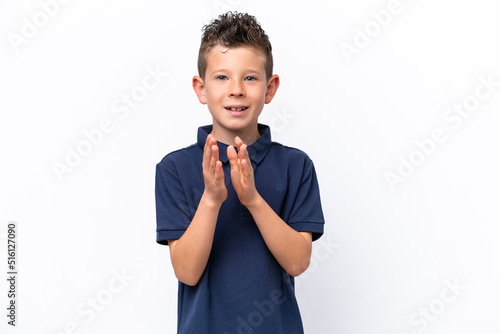 Little caucasian boy isolated on white background applauding after presentation in a conference