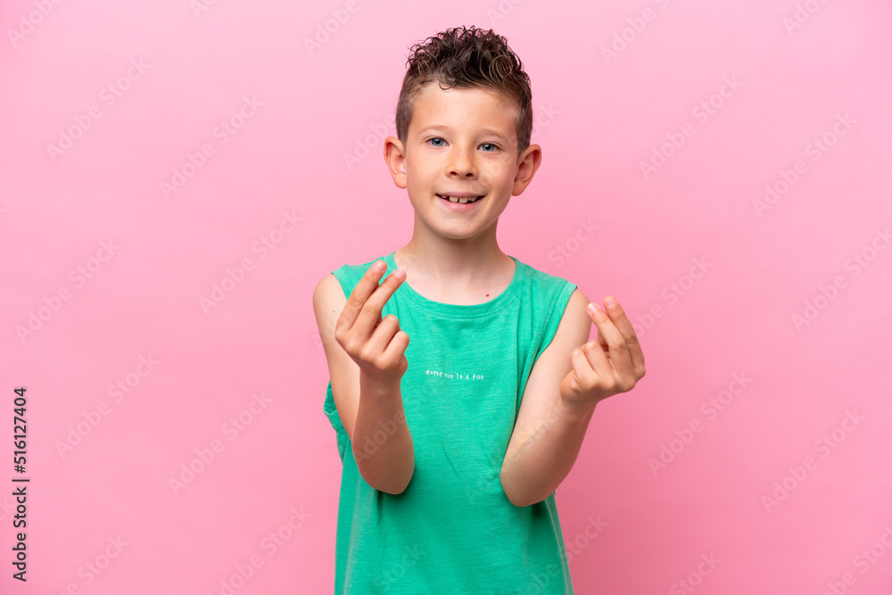 Little caucasian boy isolated on pink background making money gesture Little caucasian boy isolated on pink background making money gesture
