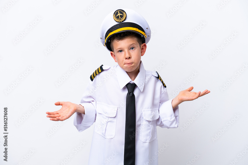 Little airplane pilot boy isolated on white background having doubts while raising hands Little airplane pilot boy isolated on white background having doubts while raising hands