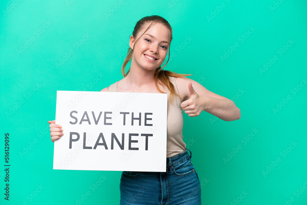 Young caucasian woman isolated on green background holding a placard with text Save the Planet with thumb up Young caucasian woman isolated on green background holding a placard with text Save the Planet with thumb up