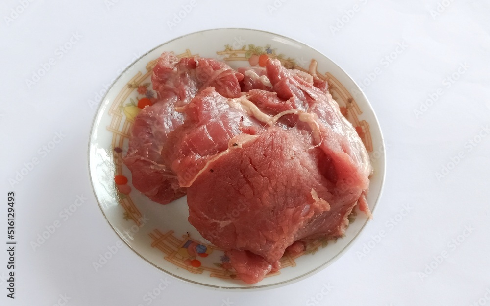 fresh beef, sacrificial meat on a white background. during Eid Al - Adha Al Mubarak, the feast of sacrifice or Qurban fresh beef, sacrificial meat on a white background. during Eid Al - Adha Al Mubarak, the feast of sacrifice or Qurban