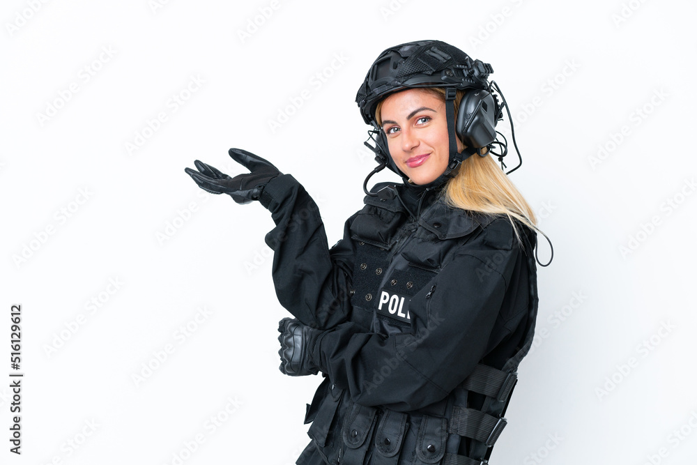 SWAT caucasian woman isolated on white background extending hands to the side for inviting to come SWAT caucasian woman isolated on white background extending hands to the side for inviting to come