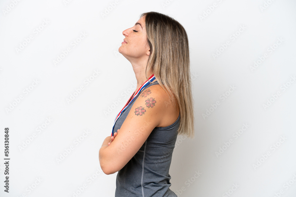 Young Rumanian woman with medals isolated on white background in lateral position Young Rumanian woman with medals isolated on white background in lateral position
