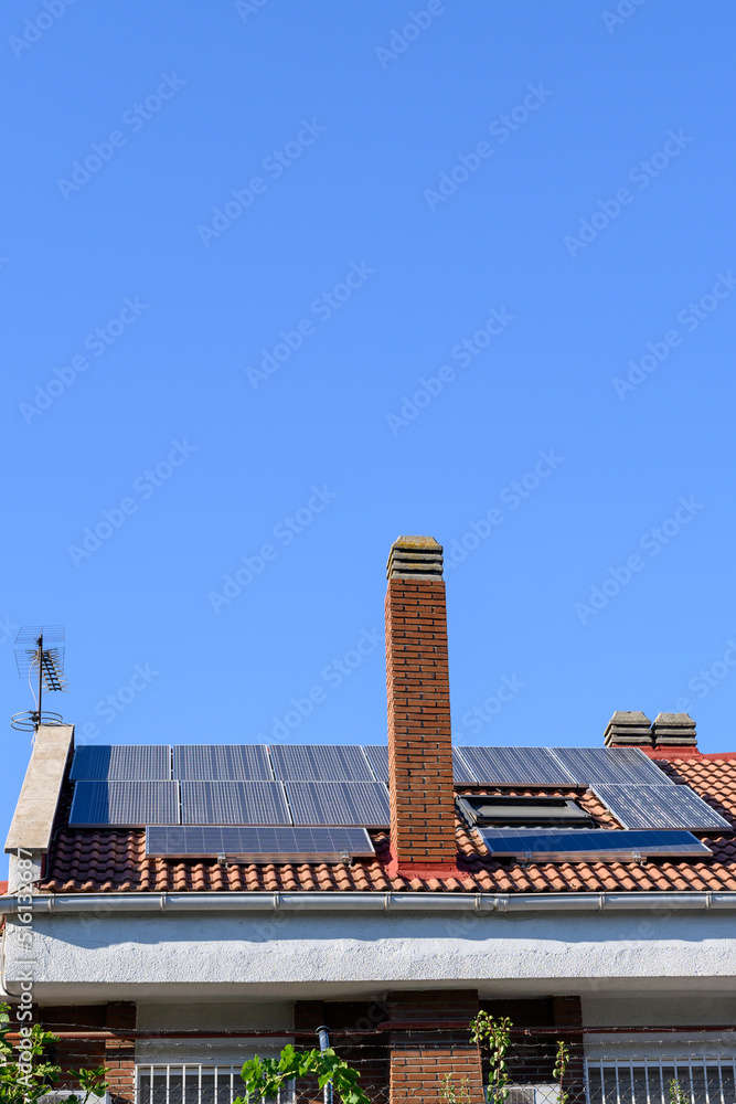 Solar panels on the roof of a house. Concept of renewable energy