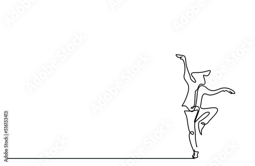 A young male relaxes doing the kung fu karate snake stance move. a person standing with one foot in the air