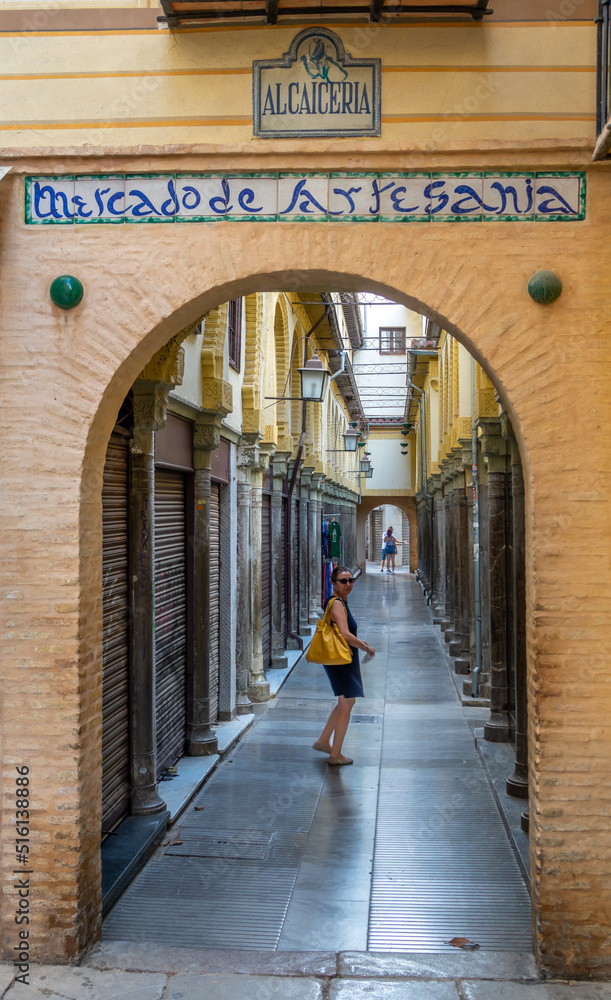 Alcaicería de Granada, narrow street with Moorish bazaars of clothing and crafts