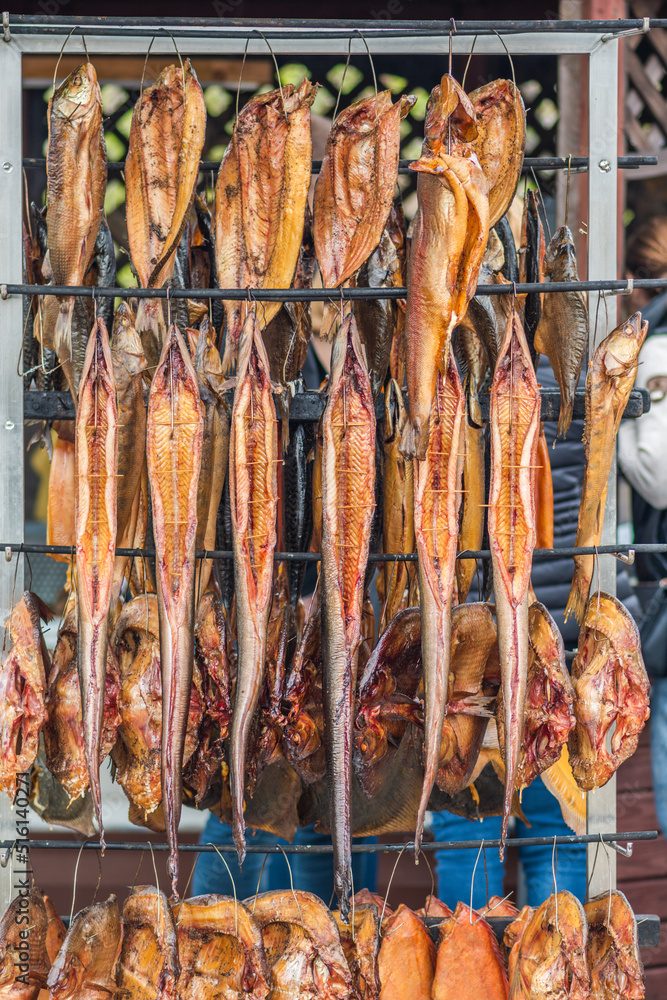 Hanging smokedried fish in a fish market just smoked with hardwood