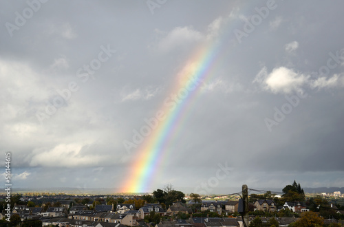 Canvas Print Rainbow seen above Rural Town