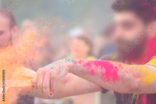 Holly's holiday! The guy pours paint on people. different colors!