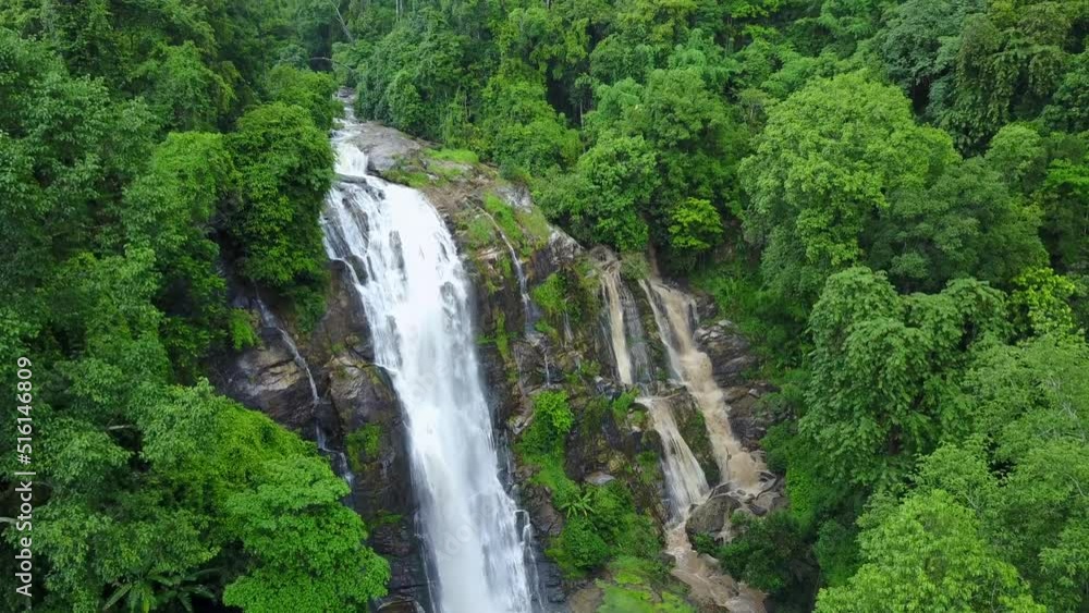 Aerial view from drone of Wachirathan Waterfalls, beautiful waterfall flowing from high cliff around with green forest background, Doi Inthanon National Park, Chiang Mai, northern Thailand. Aerial view from drone of Wachirathan Waterfalls, beautiful waterfall flowing from high cliff around with green forest background, Doi Inthanon National Park, Chiang Mai, northern Thailand.
